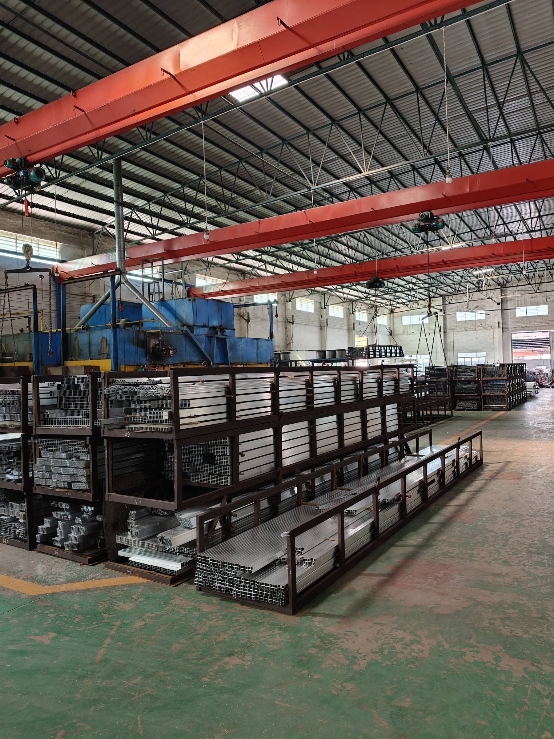 Ageing ovens and profile racks inside the extrusion plant
